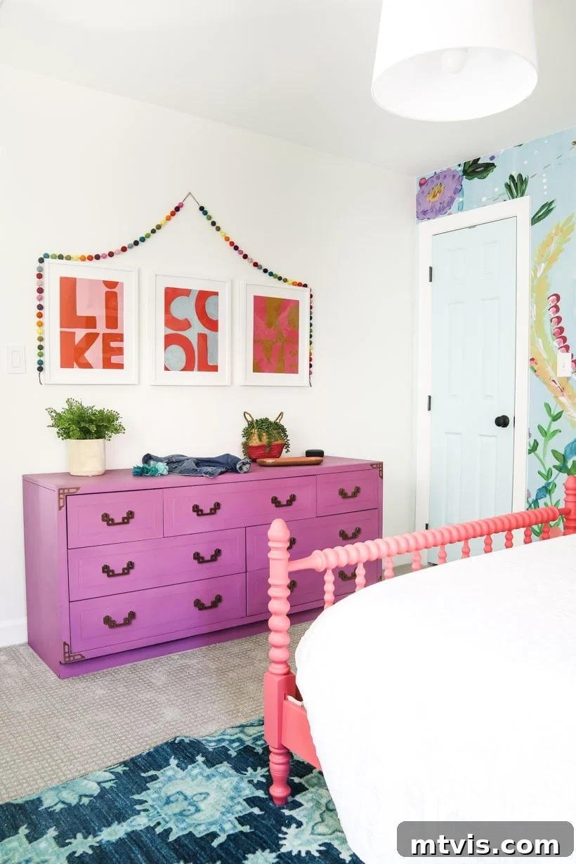 Vibrant colorful girl's bedroom showcasing a beautiful purple dresser next to the whimsical fox mural, providing stylish storage and inspiring playful kids' room decor ideas.