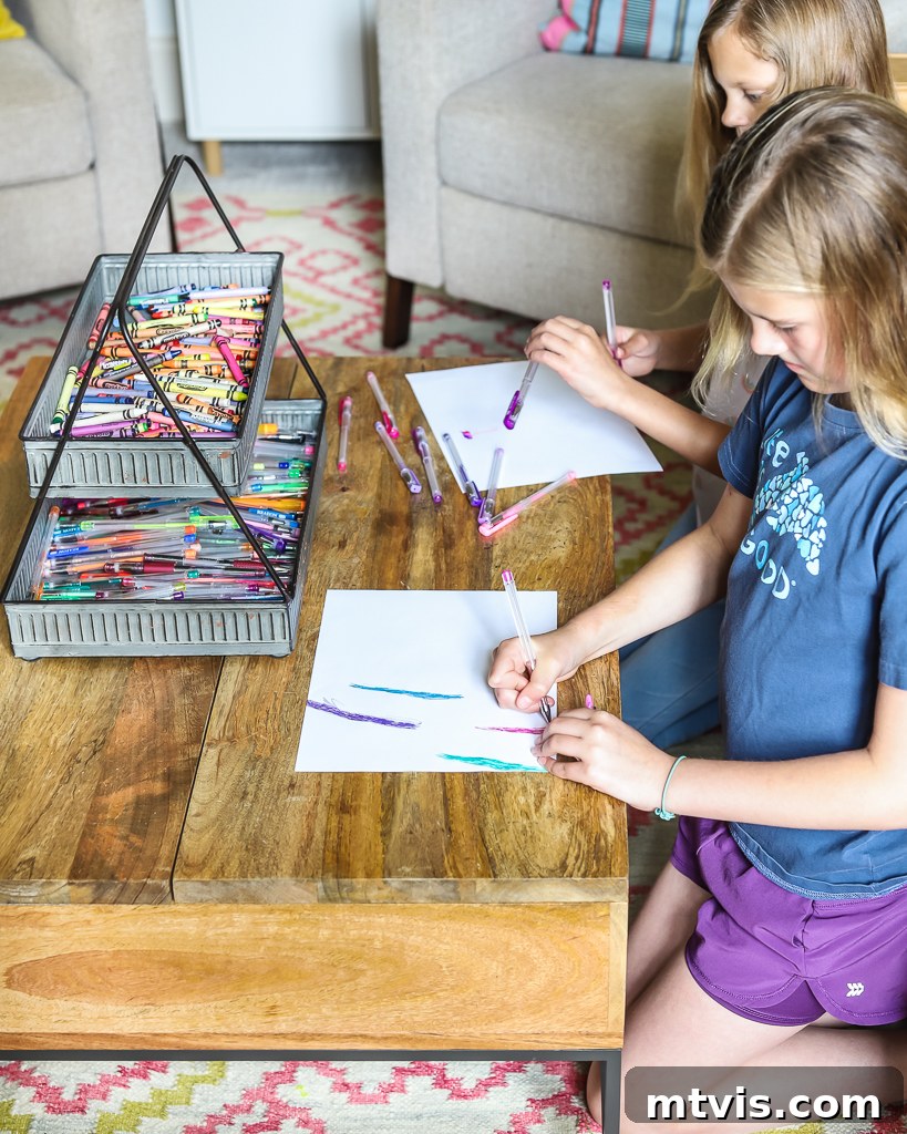 Transform Your Playroom: Simple Storage for a Clutter-Free Zone 12 A close-up of a portable art supply caddy filled with markers, crayons, and pencils, illustrating a practical toy organization solution.
