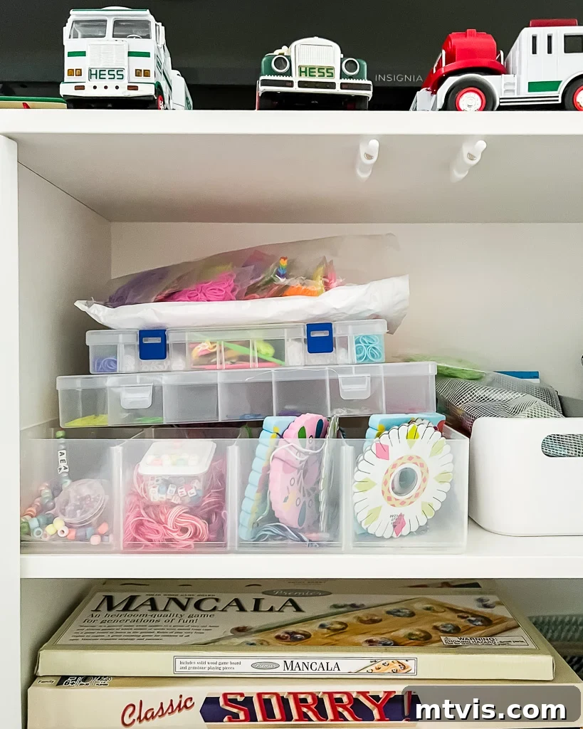 Transform Your Playroom: Simple Storage for a Clutter-Free Zone 5 Close-up of a playroom cabinet showcasing organized art supplies, including bracelet-making kits, illustrating practical toy organization solutions.