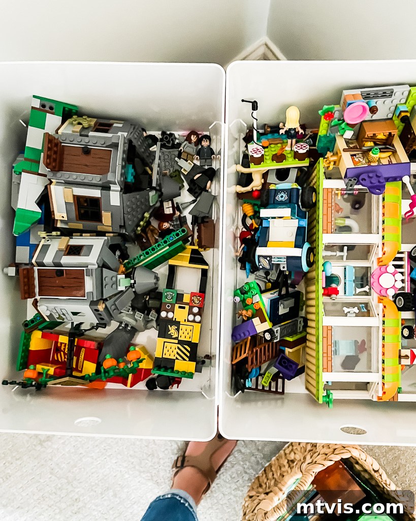 Transform Your Playroom: Simple Storage for a Clutter-Free Zone 9 An open lidded bin overflowing with various Lego pieces and assembled creations, demonstrating practical Lego storage within the playroom.