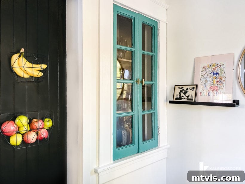 Thea Workspace Transformed 9 Integrated colorful cabinet and artwork in kitchen nook office
