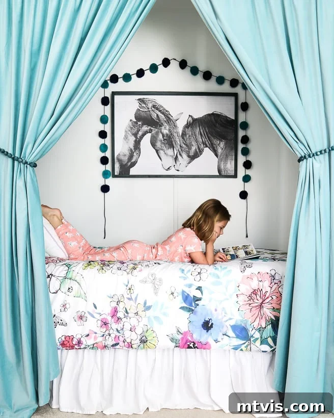 The Big Reveal: Avery's Bespoke Bunk Bed Room 2 A tween girl reads in a bed against the wall with teal bed curtains.