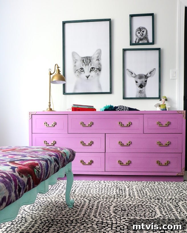 The Big Reveal: Avery's Bespoke Bunk Bed Room 3 A girl's bedroom with repurposed drawers painted purple with framed animal pictures above it.