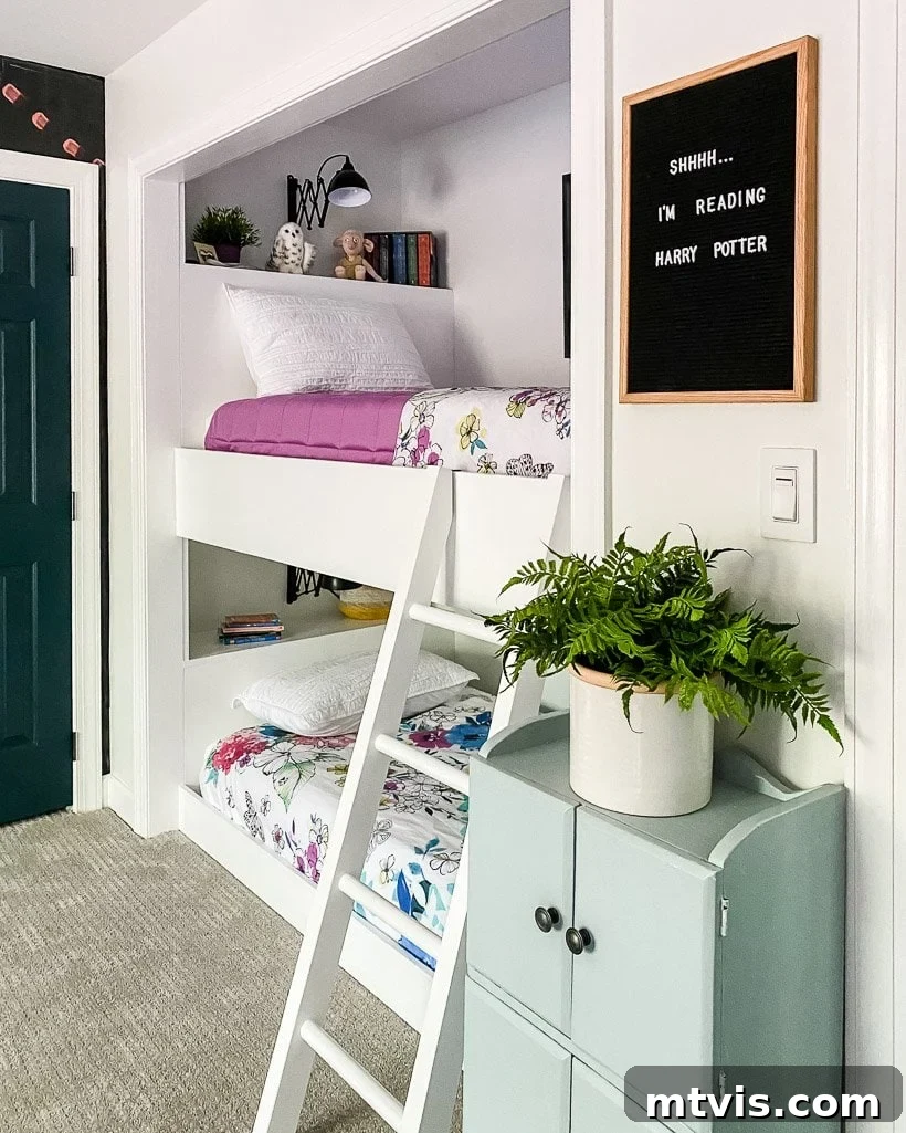 The Big Reveal: Avery's Bespoke Bunk Bed Room 6 A repurposed closet has been turned into built-in bunk beds with a white ladder and built-in shelves. A sign nearby says,