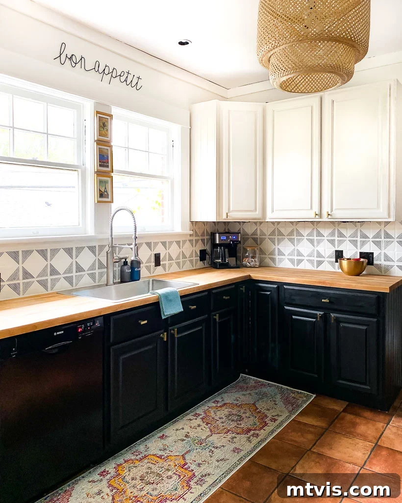 Mastering Butcher Block: Refinishing & Long-Term Care 8 Refinished butcher block countertops in a bright, white kitchen. A "bon appetit" sign hangs above the windows over a metal sink.