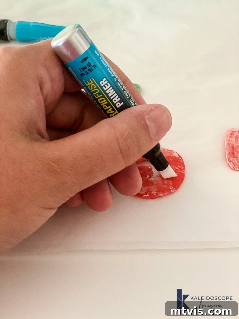 Beyond Basic Pots Polymer Clay Decorating with a Touch of Humor 6 Applying DAP plastic primer to the back of a baked polymer clay shape.
