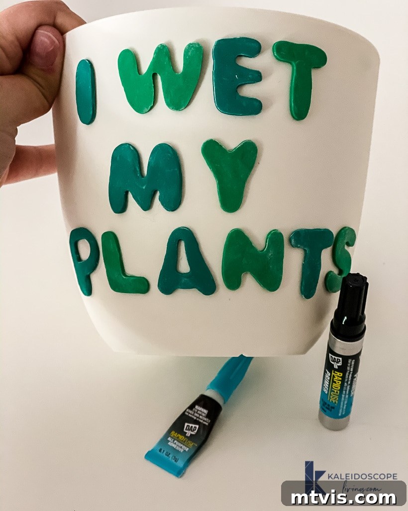 Beyond Basic Pots Polymer Clay Decorating with a Touch of Humor 8 Attaching a polymer clay shape to a plastic plant pot with DAP Rapid Fuse adhesive, holding it in place until set.