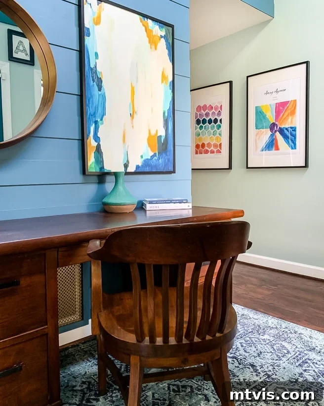 Tour Our Home's Coordinated Colorful Rugs 12 A welcoming foyer features a colorful rug and striking art, creating a stylish first impression for guests.