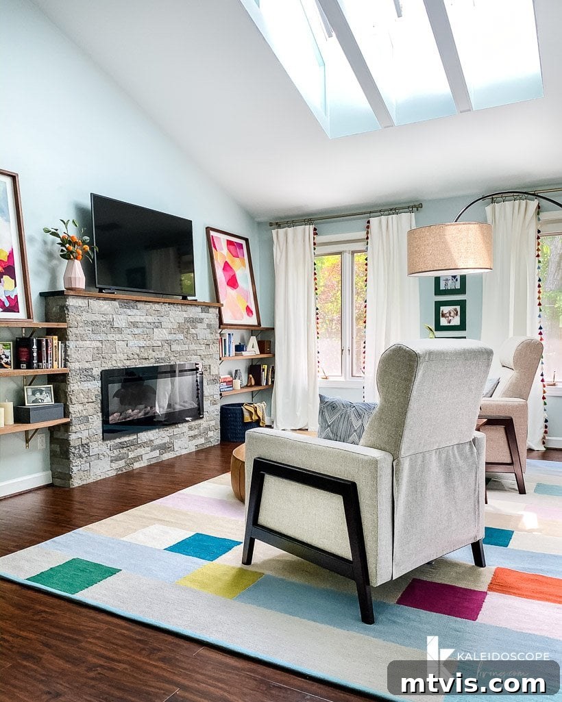 Tour Our Home's Coordinated Colorful Rugs 6 A smaller, intricate colorful rug defines a cozy sitting area within the master bedroom, adding a touch of elegance.