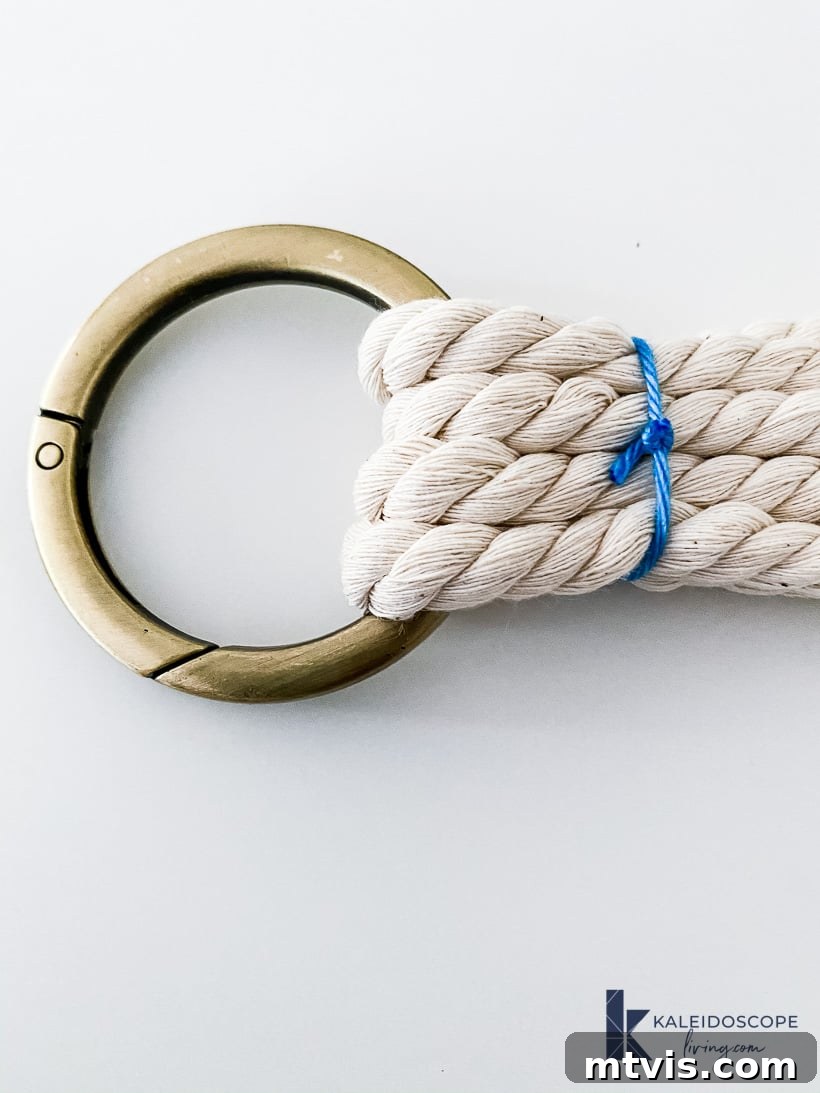 Knot Your Own Macrame Plant Hanger 3 Macrame plant hanger with rope loops threaded through a carabiner ring.