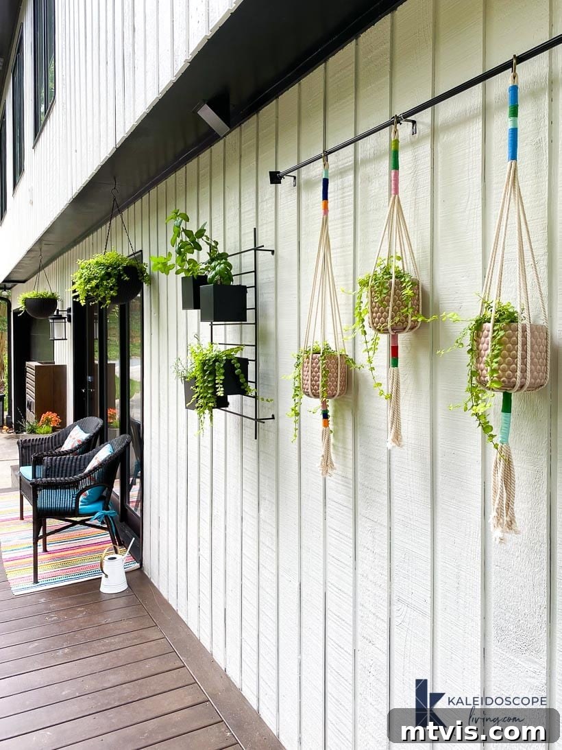 Knot Your Own Macrame Plant Hanger 9 Outdoor space featuring multiple macrame plant hangers with various plants, adding a bohemian touch.