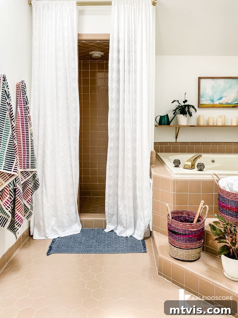 Master Bathroom Remodel on a Budget The Big Reveal 13 affordable master bathroom makeover reveal - The transformed shower area with elegant curtains and updated decor.