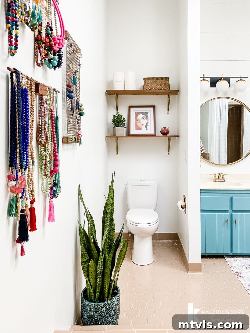 Master Bathroom Remodel on a Budget The Big Reveal 16 master bathroom budget-friendly makeover - Shelves above the toilet showcasing functional storage and decorative elements.