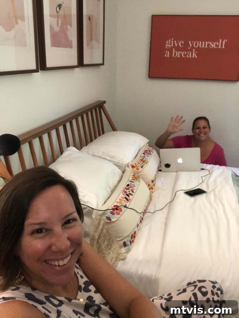 A humorous photo of podcasting setup in a bedroom, highlighting socially distanced recording.