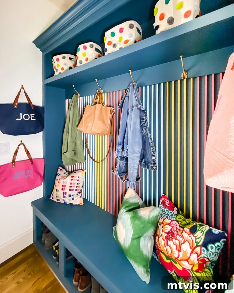 Elevate Your Entryway Smart Mudroom Designs for Active Households 3 Colorful mudroom and laundry room with slat wall