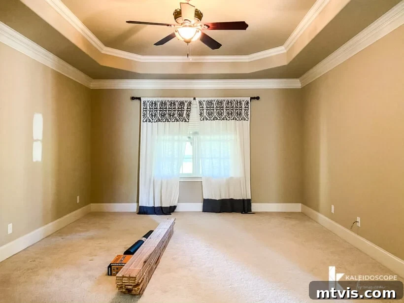 Our New House: The Blank Canvas Tour Part 1 13 Primary bedroom with a tray ceiling and carpet, awaiting hardwood installation
