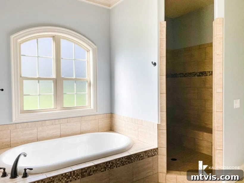Our New House: The Blank Canvas Tour Part 1 15 Spacious primary bath with a soaking tub and a separate large shower area