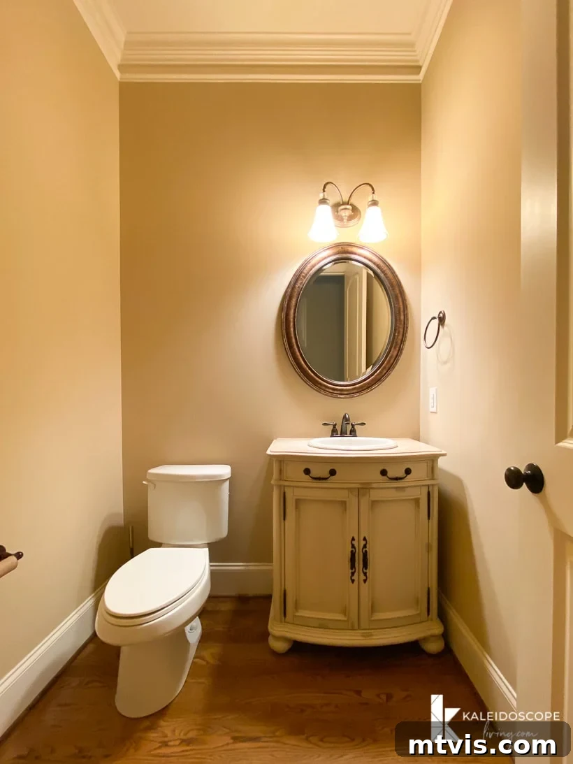 Our New House: The Blank Canvas Tour Part 1 26 Powder room with wood floors and a pedestal sink, awaiting transformation