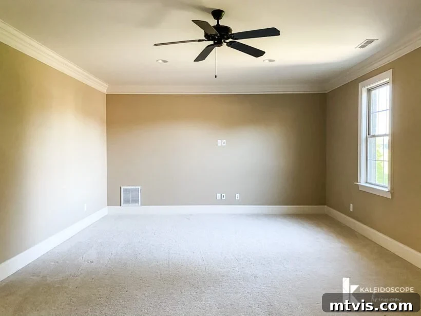 Unboxing Our New House: The Raw Tour Part 2 9 Spacious bonus room, currently empty with beige walls and carpet, ready for transformation.