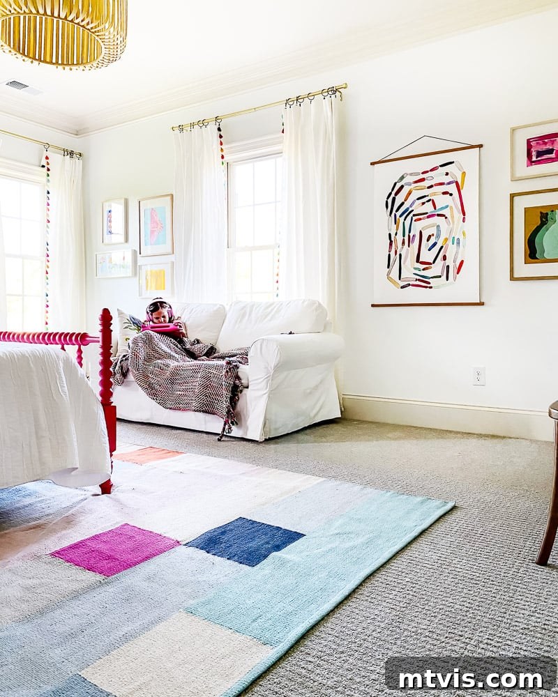 Transform Your Space: The Ultimate Guide to Large Wall Art 12 A colorful girl's bedroom featuring a large framed abstract art piece above the bed.