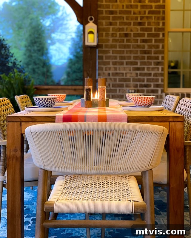 Outdoor Oasis: Screened Porch Tour & Decor Tips 15 Serene screened-in porch featuring elegant string lights, creating a captivating night scene.