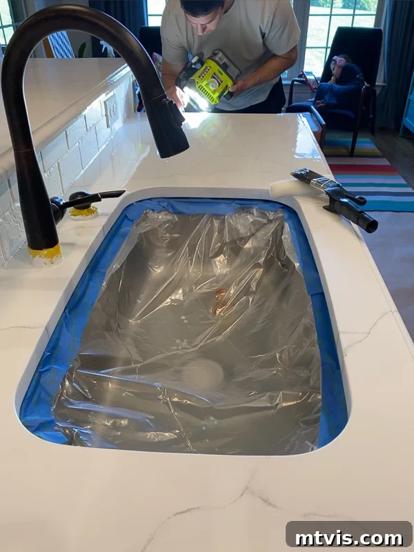 Paint Your Countertops Like a Pro: Essential Tips for a Flawless Finish 18 cleaning lint out of epoxy resin topcoat on countertops by Tasha Agruso of Kaleidoscope Living