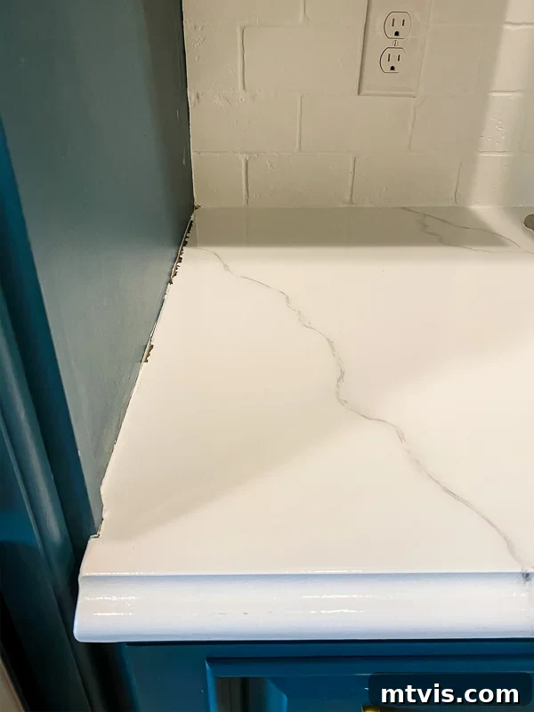 Paint Your Countertops Like a Pro: Essential Tips for a Flawless Finish 20 marble painted kitchen countertops before caulking by Tasha Agruso of Kaleidoscope Living