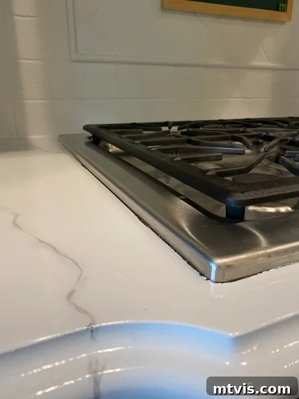 Paint Your Countertops Like a Pro: Essential Tips for a Flawless Finish 21 marble painted kitchen countertops before caulking by Tasha Agruso of Kaleidoscope Living