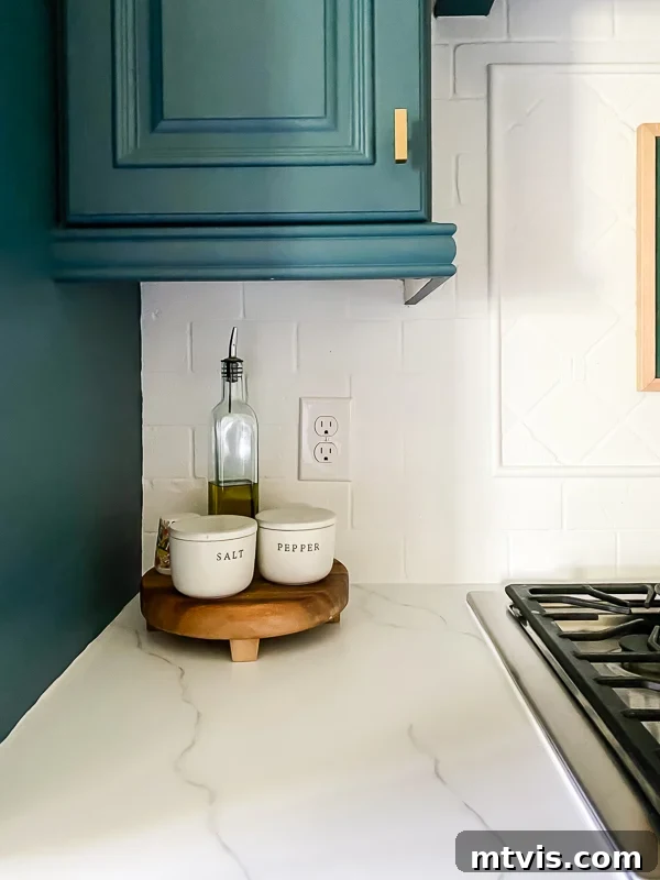Paint Your Countertops Like a Pro: Essential Tips for a Flawless Finish 22 marble painted kitchen countertops after caulking by Tasha Agruso of Kaleidoscope Living