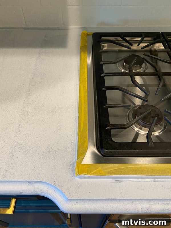 Paint Your Countertops Like a Pro: Essential Tips for a Flawless Finish 8 taped off stovetop for painting countertops by Tasha Agruso of Kaleidoscope Living