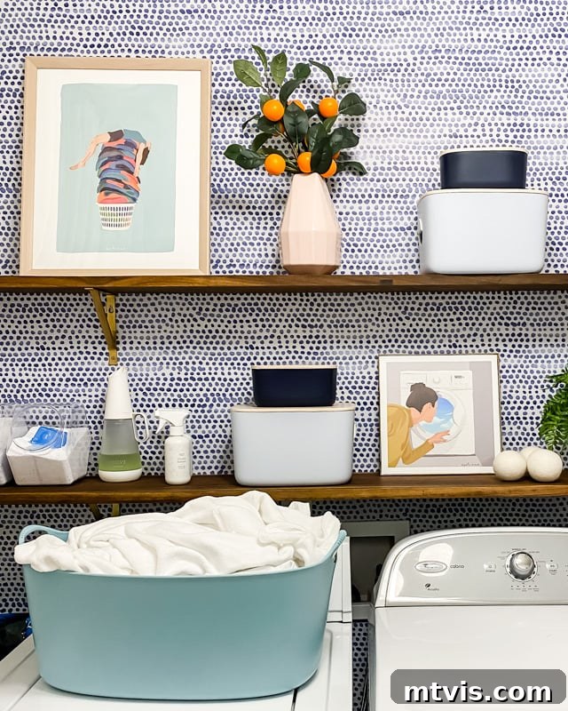 Unveiling Our Chic Modern Laundry Oasis 11 colorful art on open shelves in laundry room