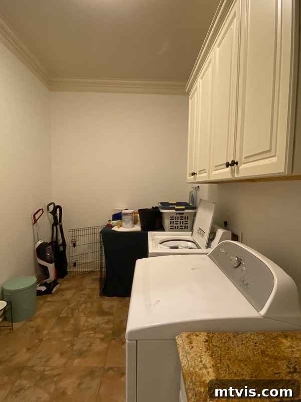 Unveiling Our Chic Modern Laundry Oasis 3 outdated laundry room before makeover - side view