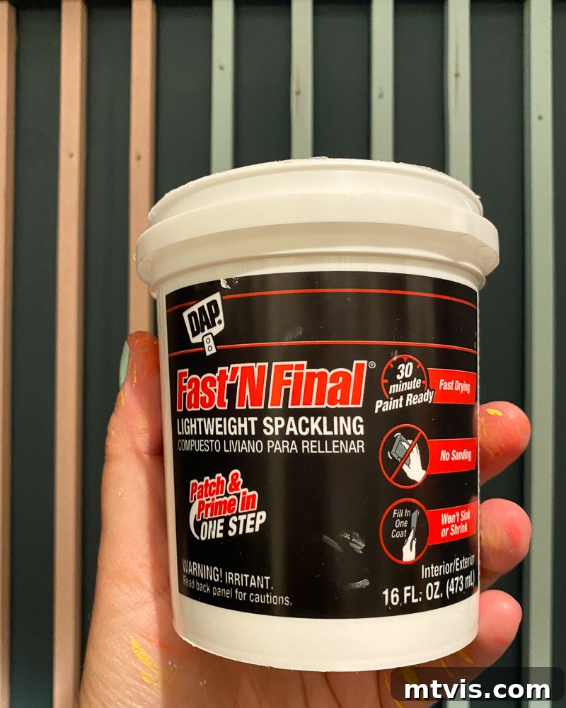 Modern Wood Slat Wall Transformation 8 DAP Fast N' Final lightweight spackling for easy and quick nail hole filling in DIY projects