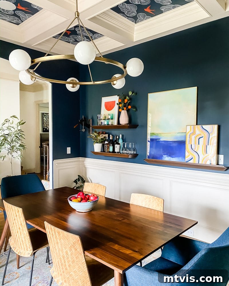Colorful layered art on a dining room ledge, blending calm and energetic pieces