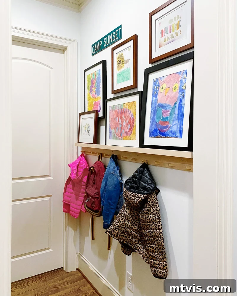 Mudroom with an art ledge displaying a mix of hung and rested small art