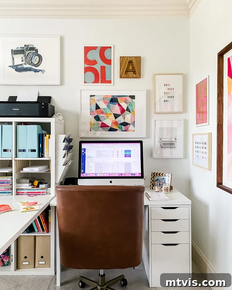 Bright office gallery wall showcasing a mix of large and small art