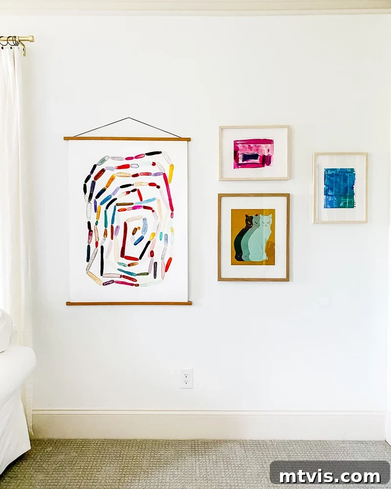 Seamless Spaces: Discover Our Gallery of Flowing Colors 20 Detailed view of colorful artwork in a girl's room, including a spiral print and watercolor abstracts.