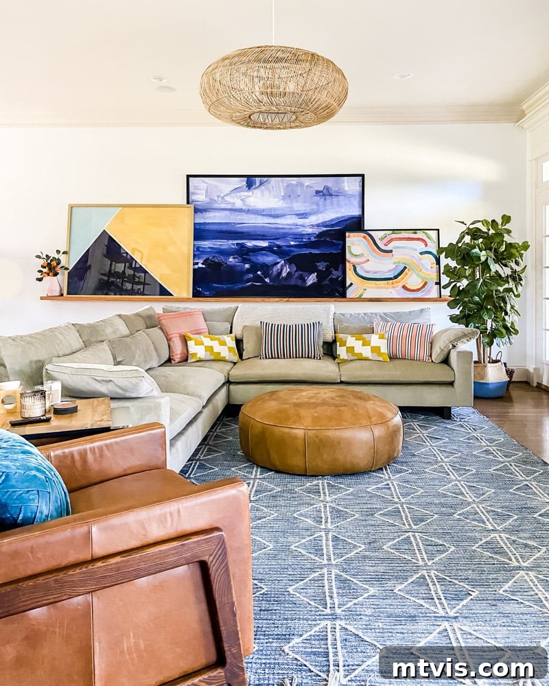 Seamless Spaces: Discover Our Gallery of Flowing Colors 6 Large-scale colorful abstract art displayed on a DIY art ledge in a cozy family room.