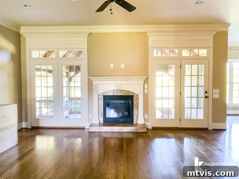 Our Fireplace Glow-Up Revealed 2 Outdated beige fireplace in a family room before renovation