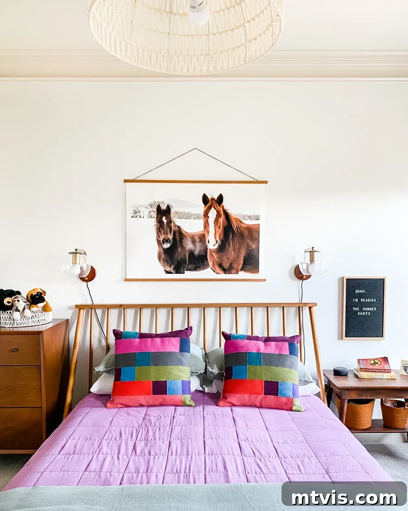 Stylish mid-century modern wall decor in Avery's room, complementing the purple and green theme and adding character to the space.