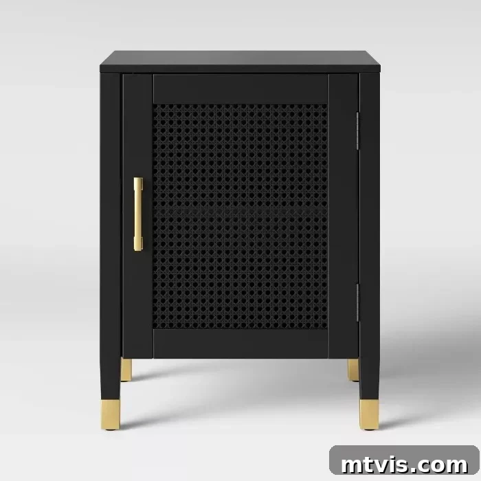 A sophisticated black caned nightstand with gold accents, ideal for smaller bedrooms, offering style without sacrificing space.