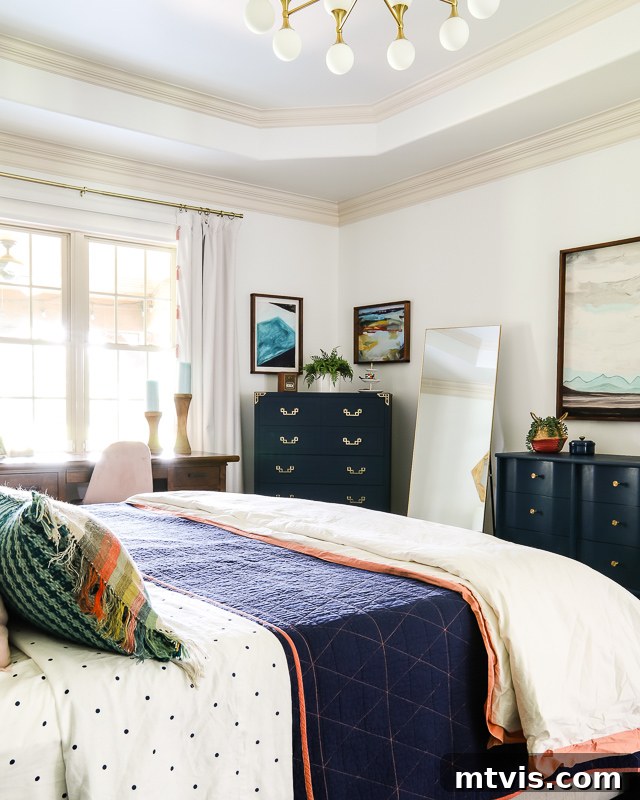 Our Primary Bedroom Design Dilemmas 4 colorful master bedroom with navy furniture, dark rug, and cream curtains