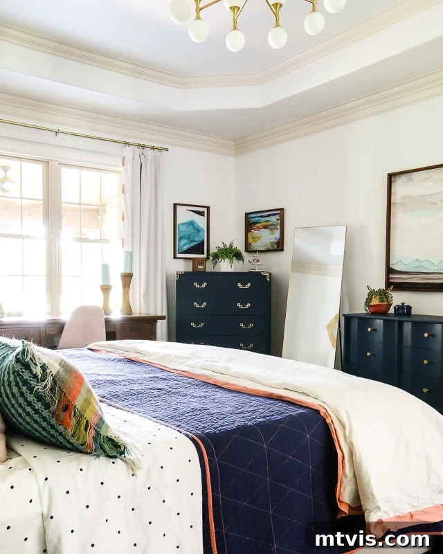 Masterful Style Without The Massive Price Tag 3 Colorful bedroom with navy furniture, featuring a modern dresser