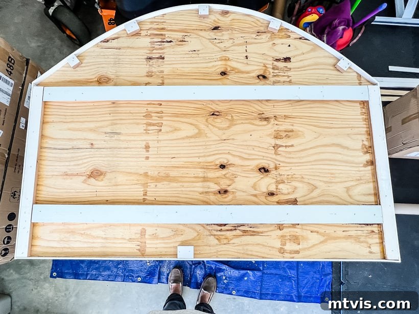 Back of DIY headboard with cleats and trim attached