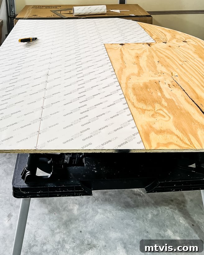 Applying Musselbound adhesive tile mat to plywood headboard