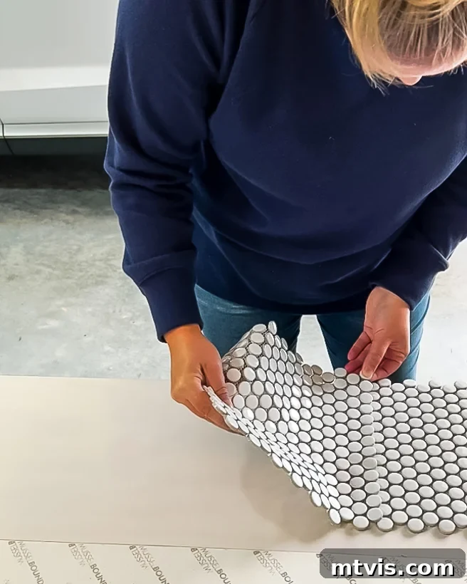 Laying penny tiles on the headboard