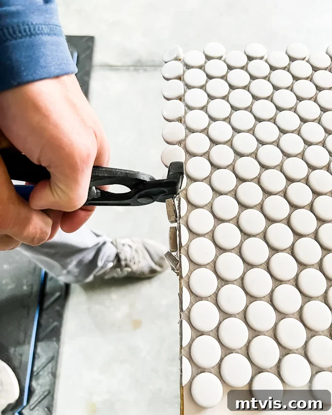 Trimming penny tiles with tile nippers