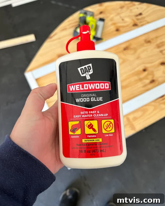 Applying DAP original wood glue to attach nailing blocks