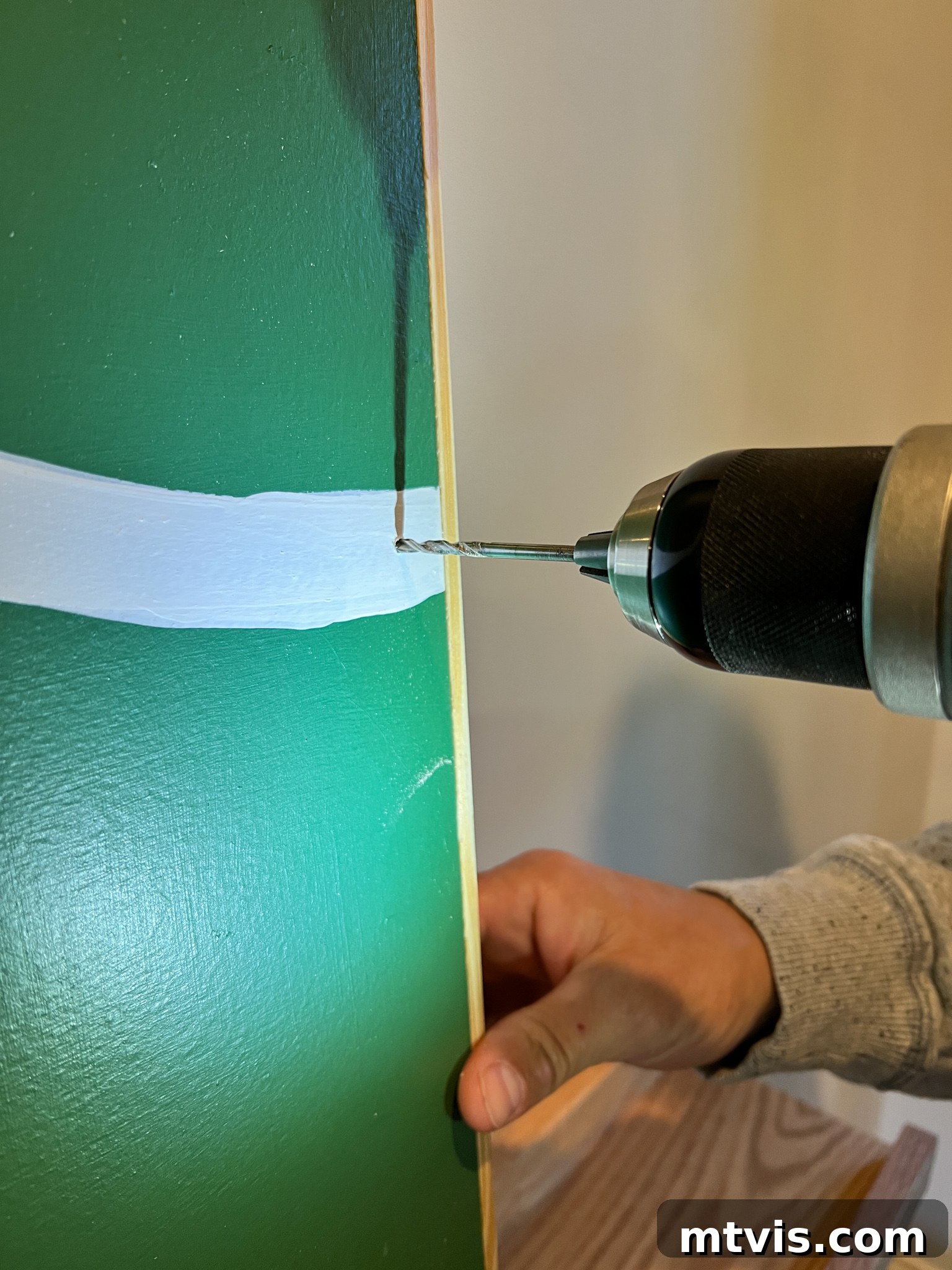 Threading dewdrop lights through a small drilled hole to hide the battery pack