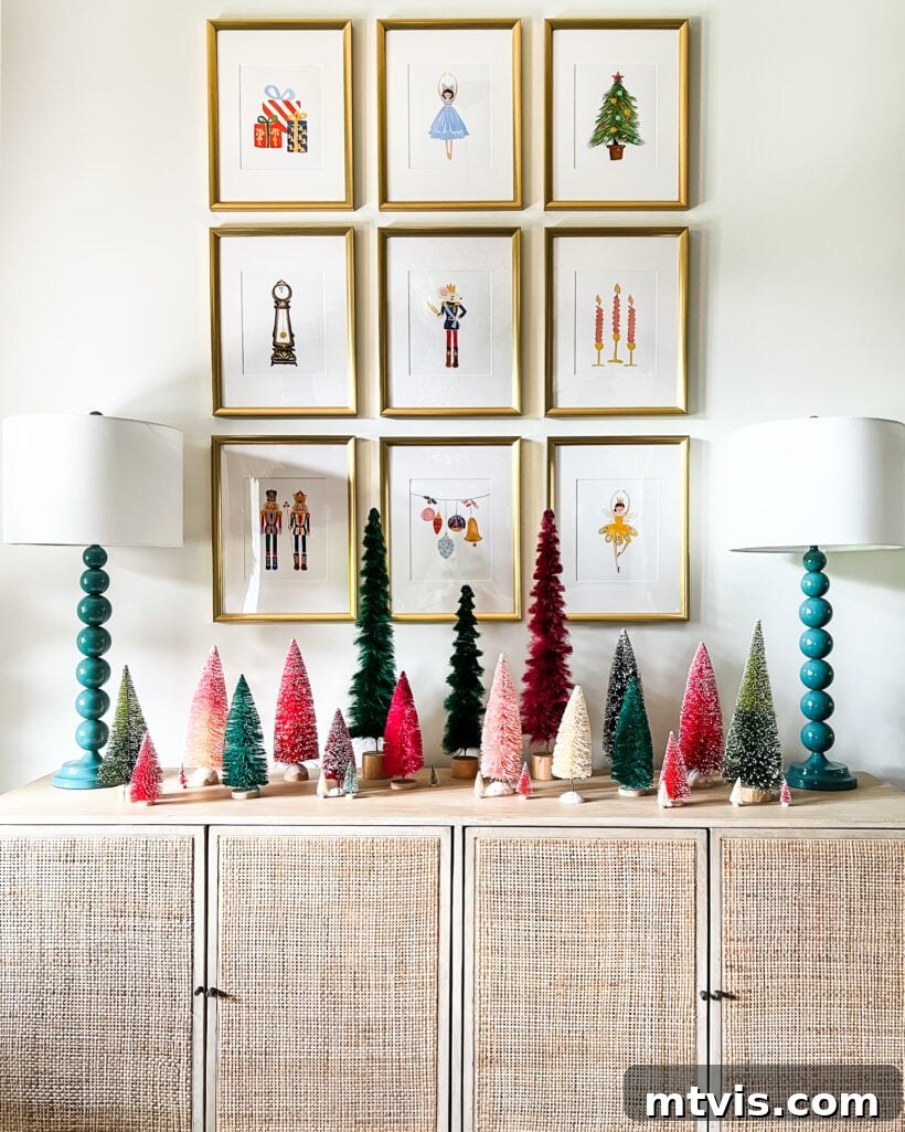 A Spectrum of Holiday Cheer: Our 2021 Christmas Home Tour 20 Foyer decorated for Christmas with Nutcracker art prints and a collection of colorful bottlebrush trees.